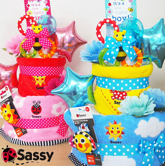 サッシーの人気ベビーアイテムおむつケーキ【Ｓサイズ・フラワーピンク/スマイリー】SASSY/出産祝い/ポップキャンディー